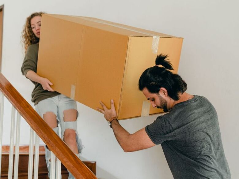 Senior Moving Company crew carrying boxes into a DFW retirement community